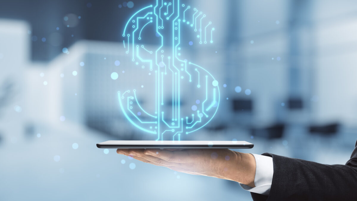 Close up of businessman hands holding tablet with abstract glowing blue circuit dollar hologram on blurry bokeh office interior background. Online banking and financial technology concept. Double exposure.